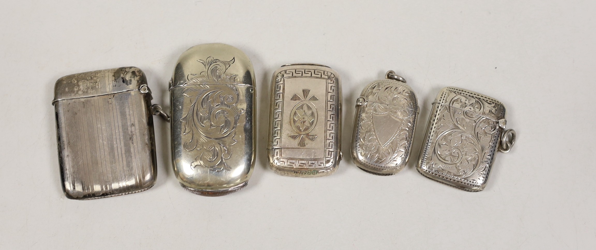 Three assorted early 20th century silver vesta cases, largest 56mm and two plated cases.